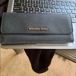 Michael Kors black wallet.
